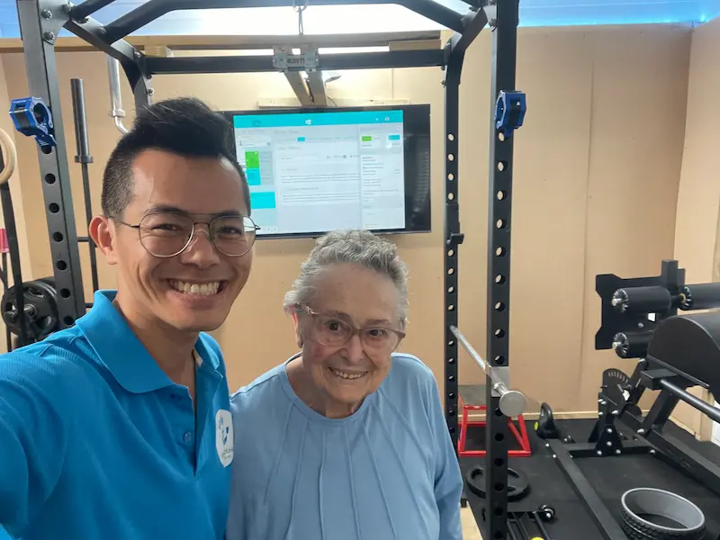 Home care package massage — assessment-led movement training with a senior client at Heal Young Massage Varsity Lakes